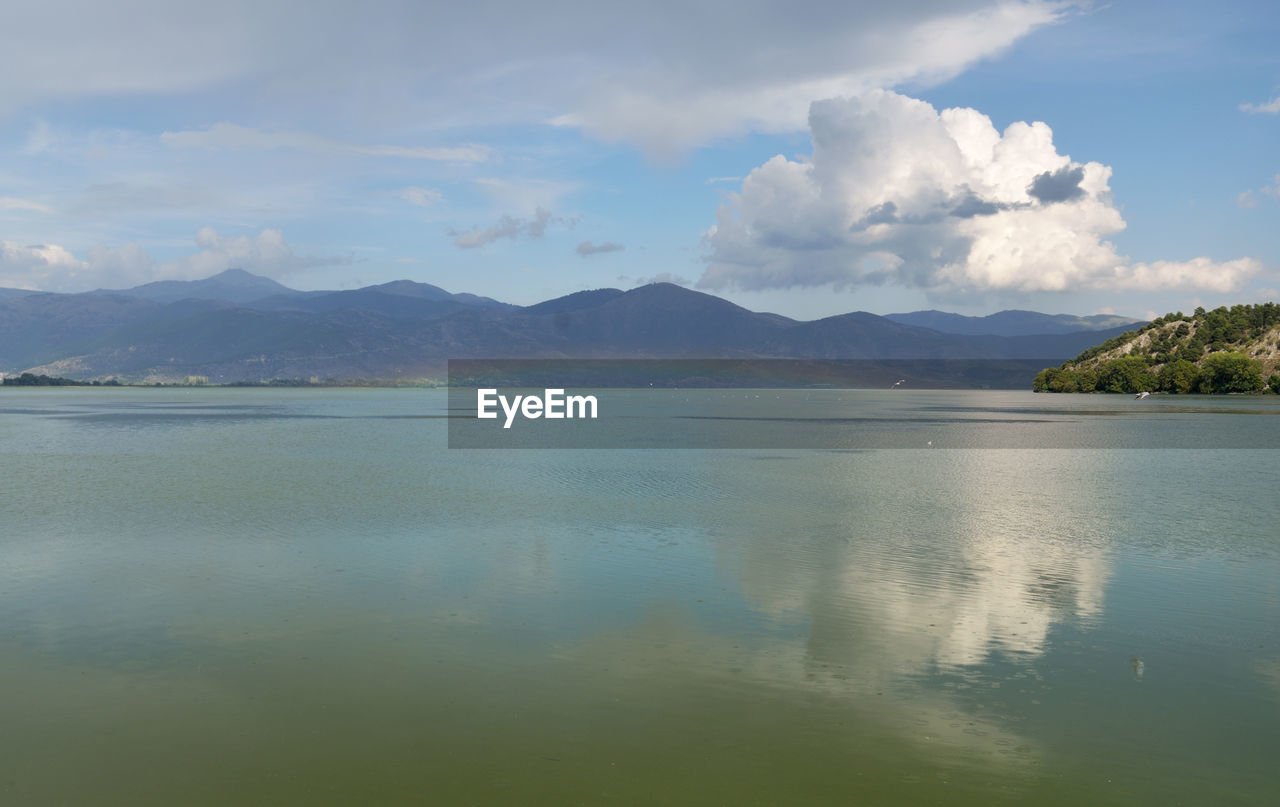 Landscape with rainbow over the lake