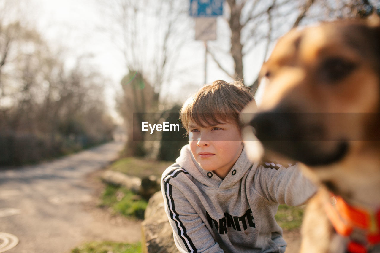 PORTRAIT OF BOY LOOKING AWAY