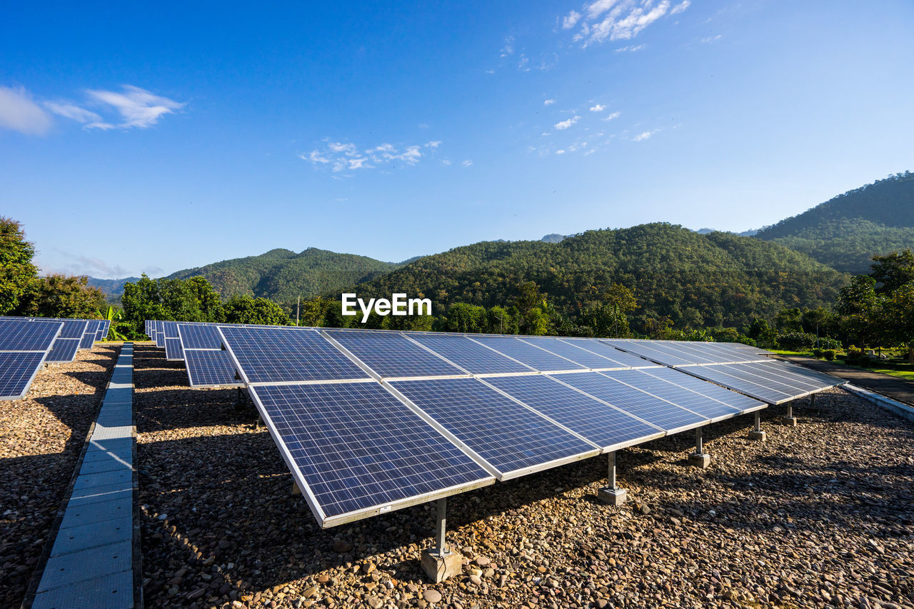 SCENIC VIEW OF LANDSCAPE AND MOUNTAINS AGAINST SKY