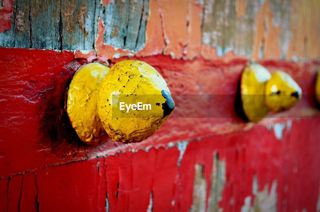 Close-up of doorknobs on old wooden door