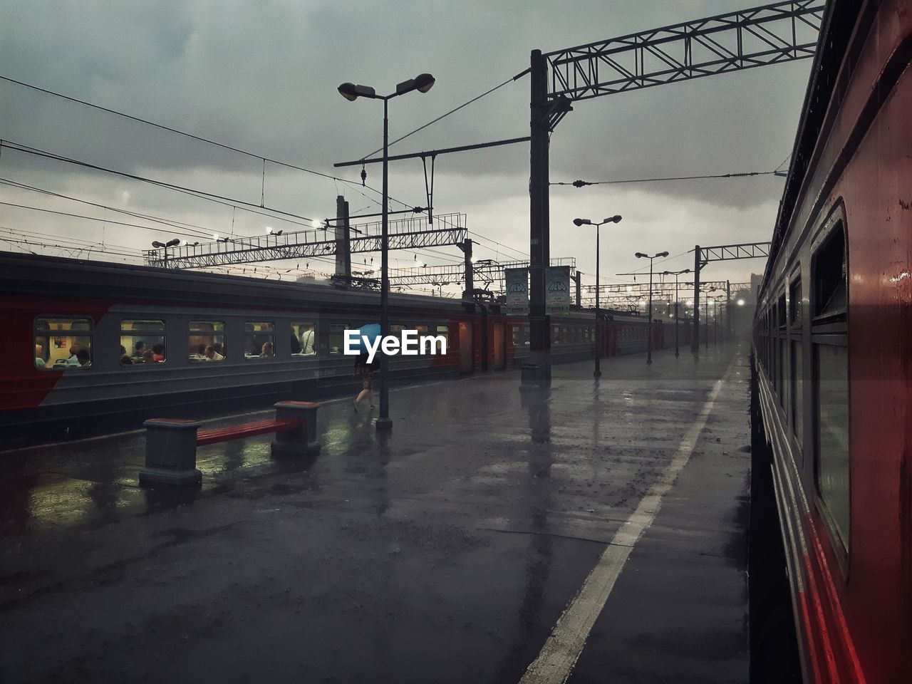 Train at railroad station against sky