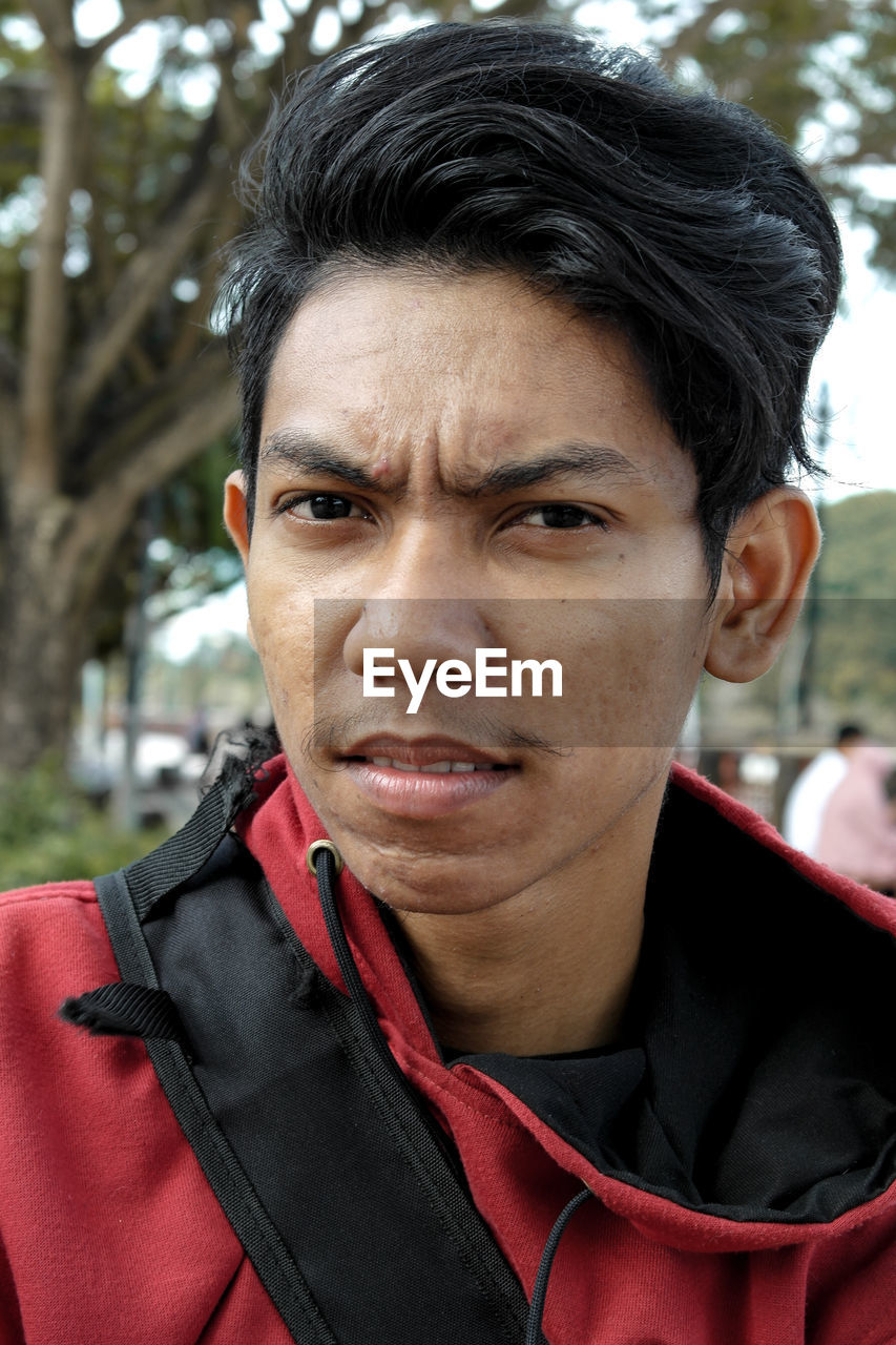 Close-up portrait of young man outdoors