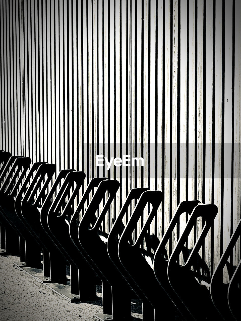 Empty chairs against wall