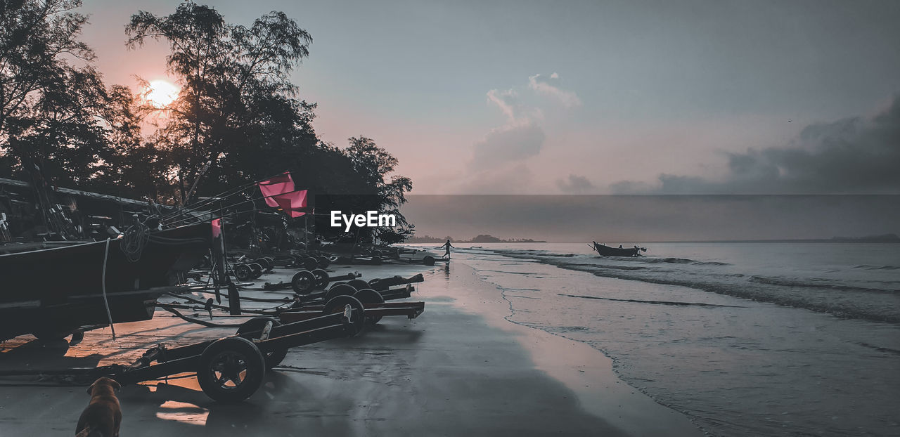 Scenic view of beach against sky during sunset