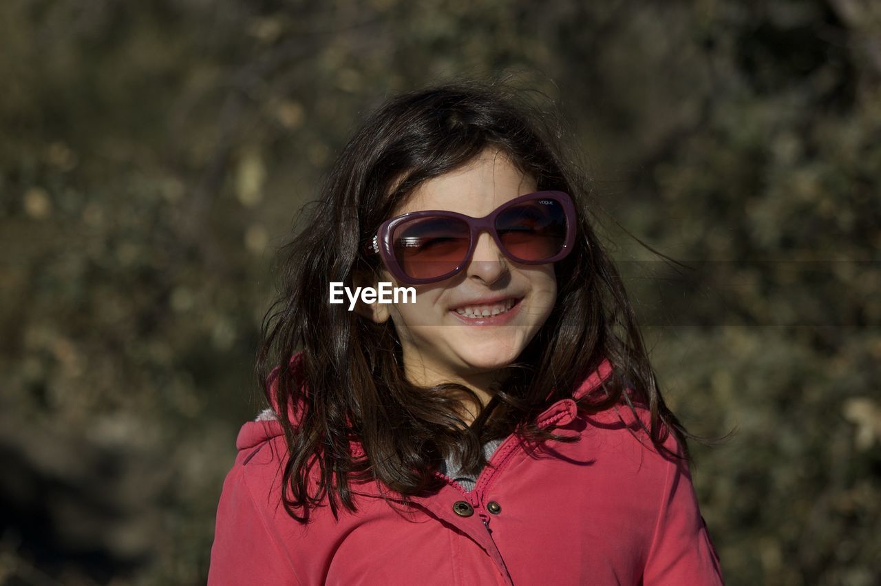 Smiling girl wearing sunglasses