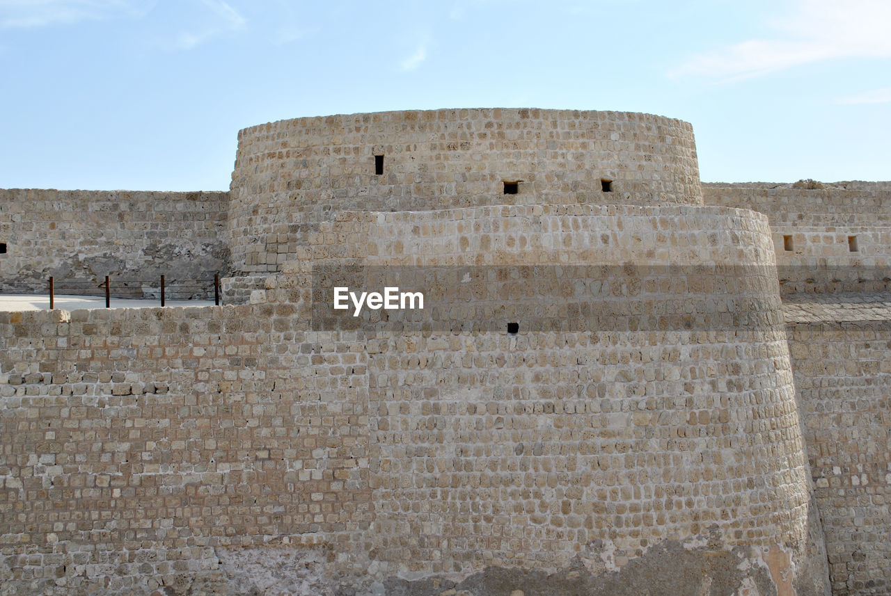 LOW ANGLE VIEW OF FORT ON WALL