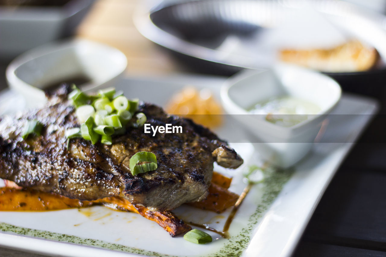 CLOSE-UP OF FOOD SERVED ON TABLE