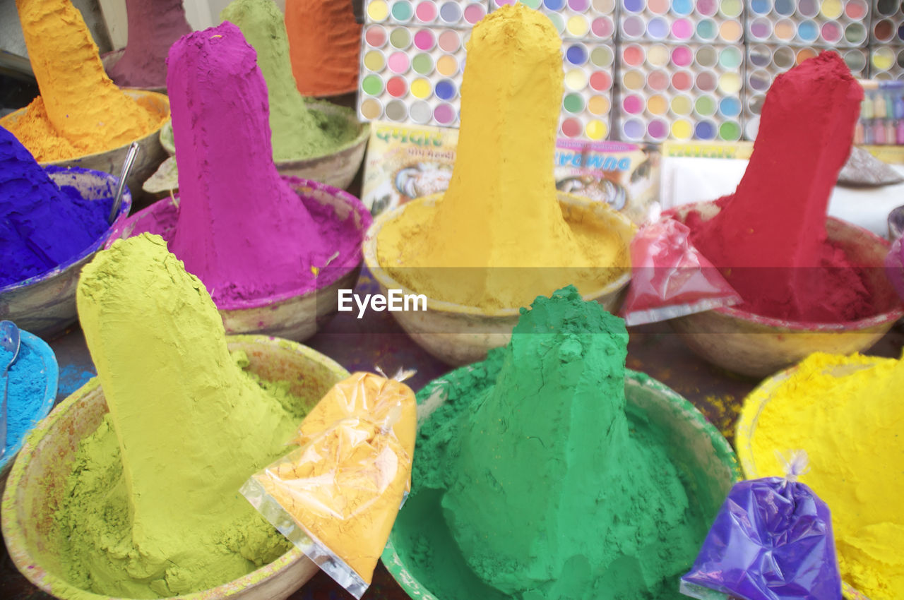 Close-up of multi colored powder paints for sale