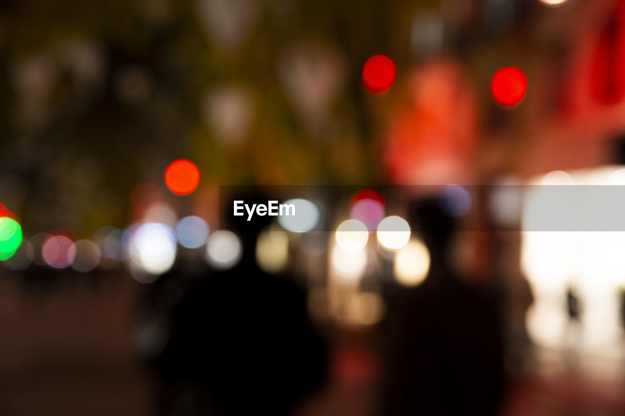 DEFOCUSED IMAGE OF ILLUMINATED CITY