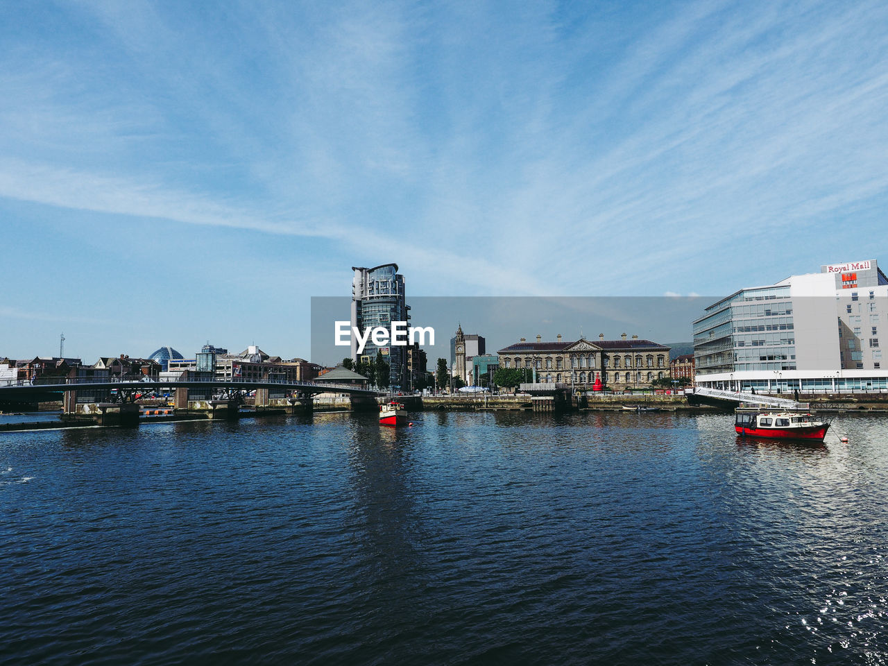 BRIDGE OVER RIVER AGAINST BUILDINGS