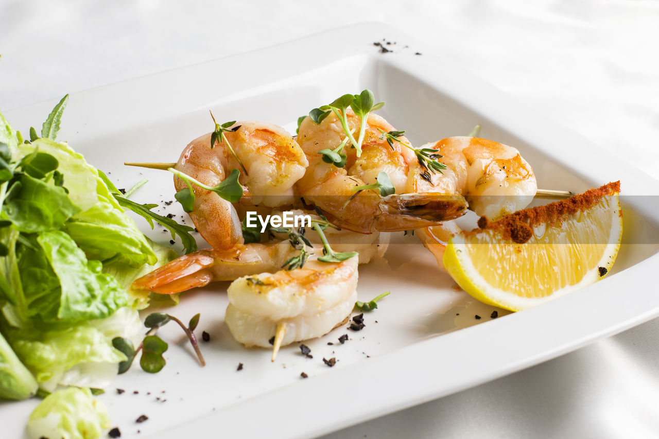 Close-up of shrimps served in plate on table