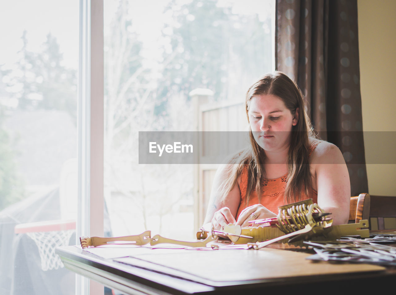 REAR VIEW OF MAN SITTING ON BENCH