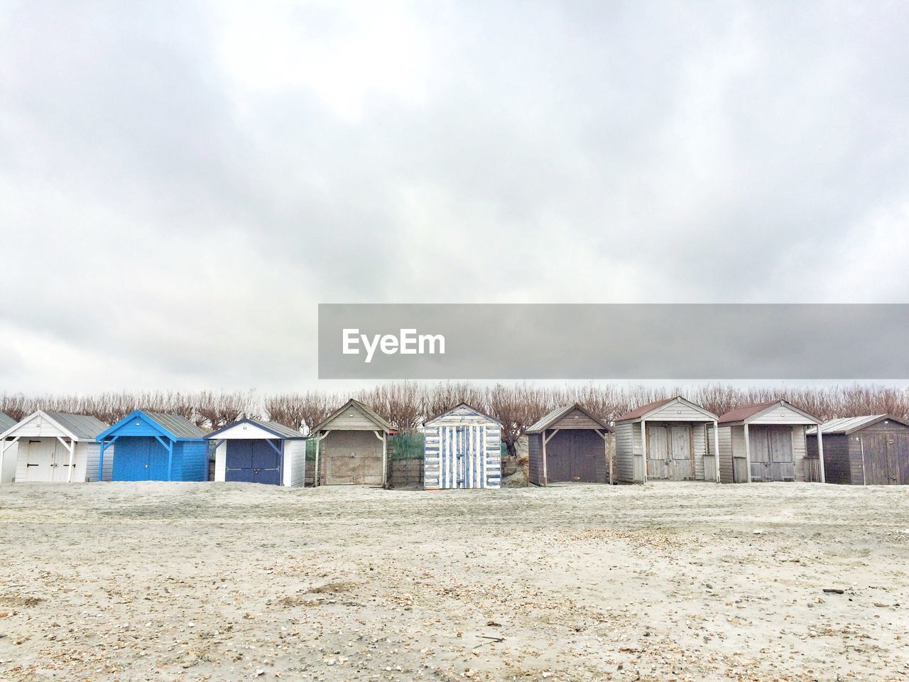 Beach huts against clouds