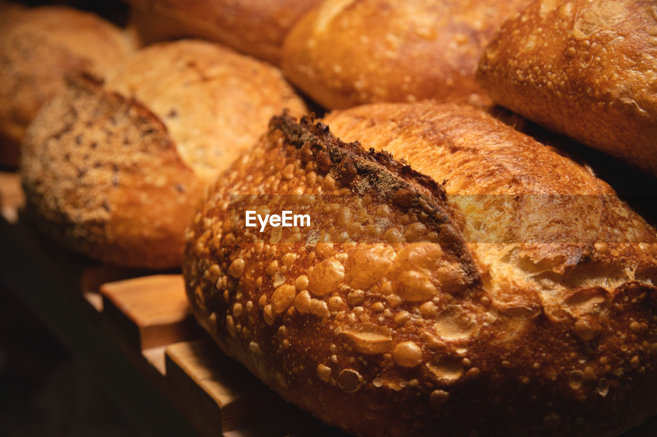 Freshly baked hot loaves of crispy artisan bread close-up. healthy foods and proper nutrition