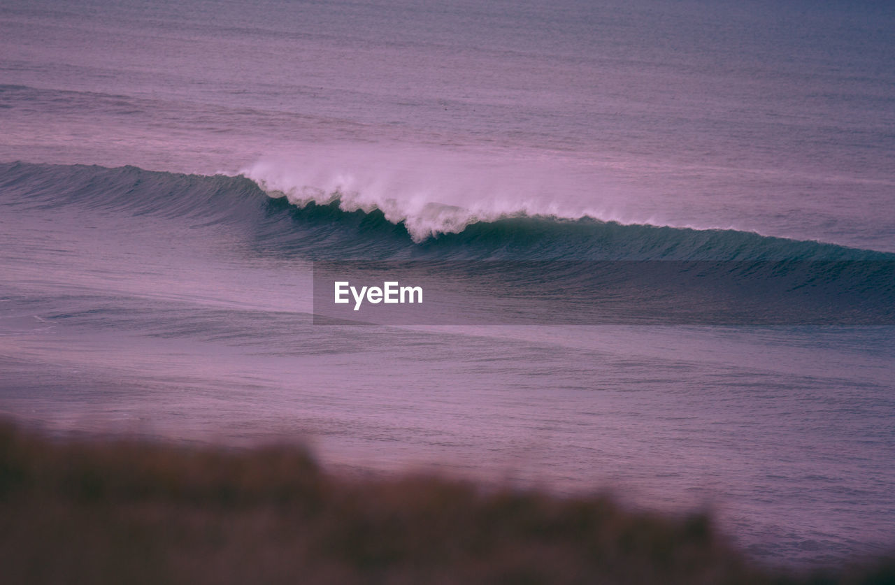 Scenic view of waves rushing towards shore