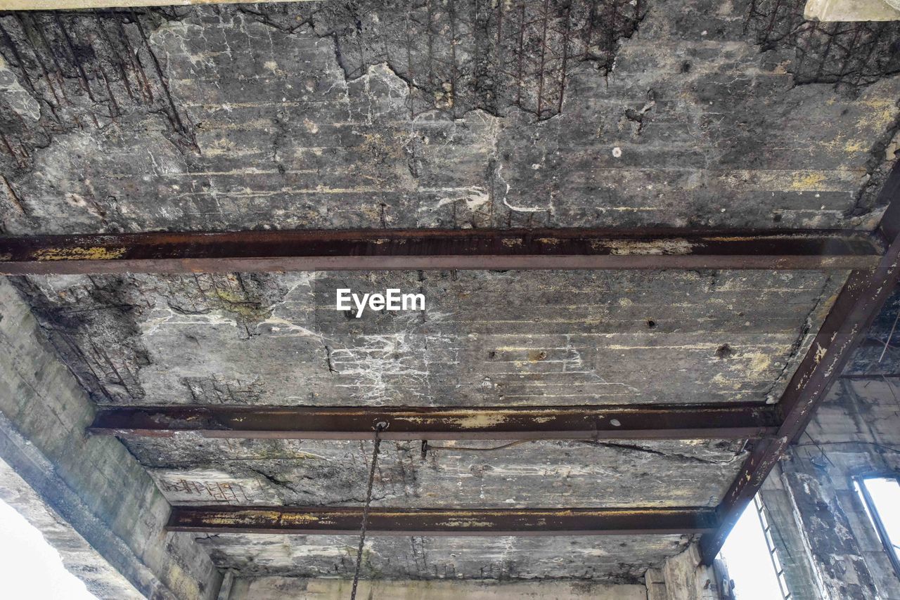 Low angle view of ceiling in abandoned building