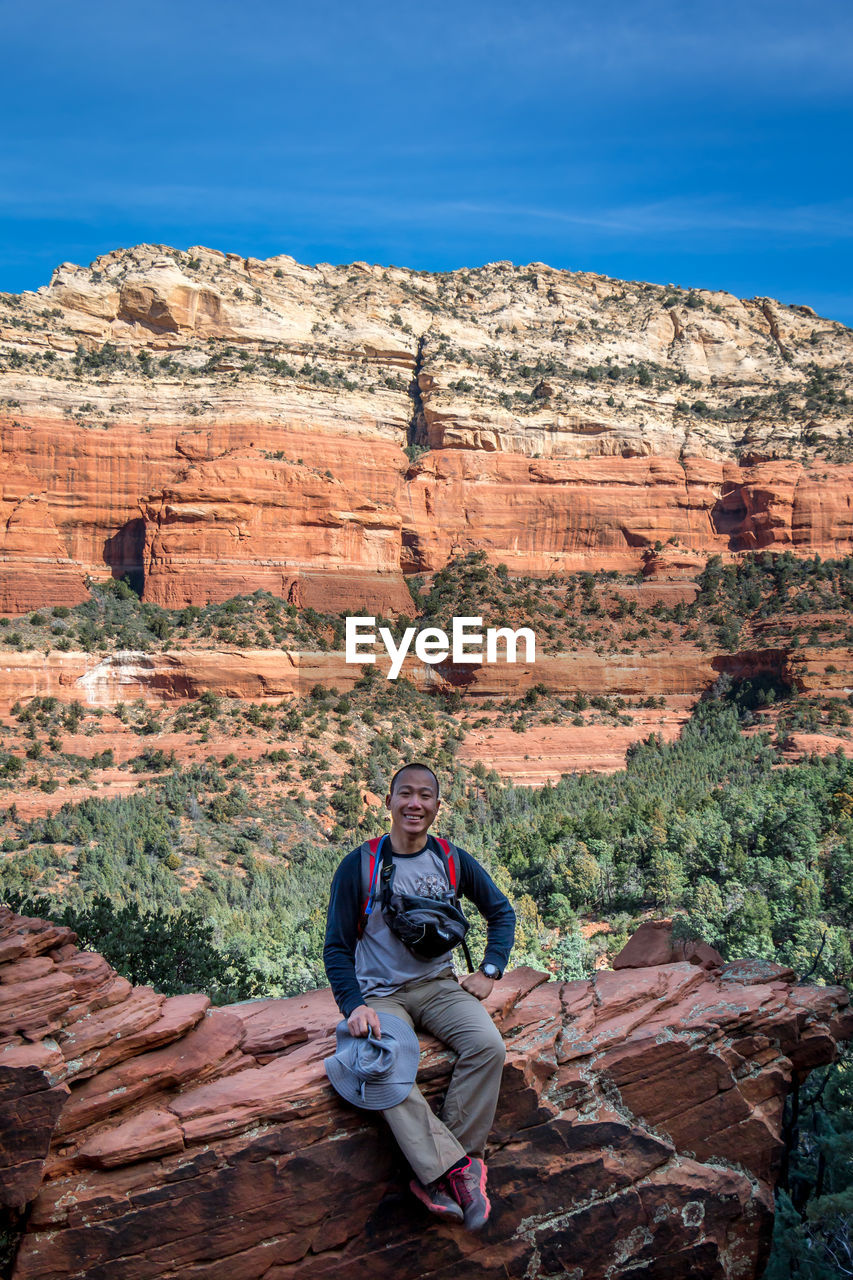 Man sitting on rock