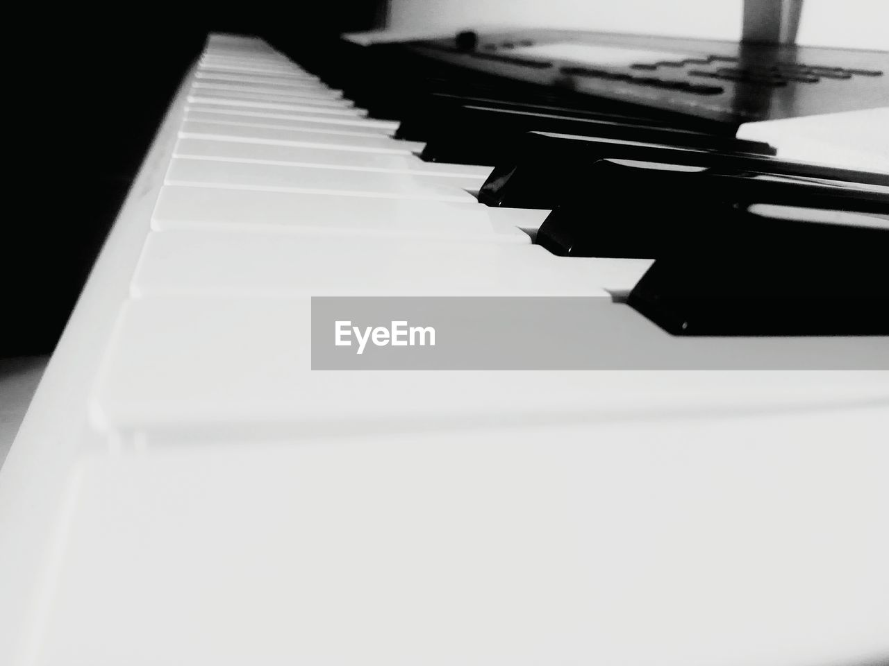 CLOSE-UP OF PIANO KEYS AT HOME