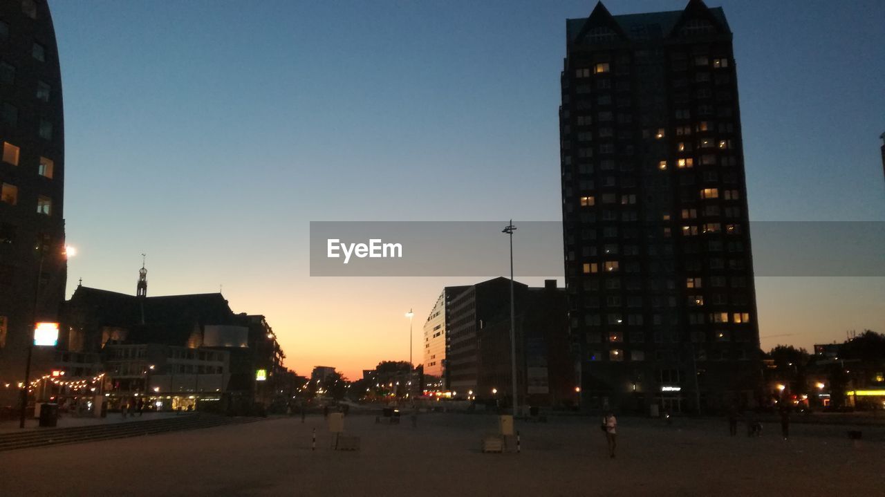 SILHOUETTE OF BUILDINGS AT DUSK