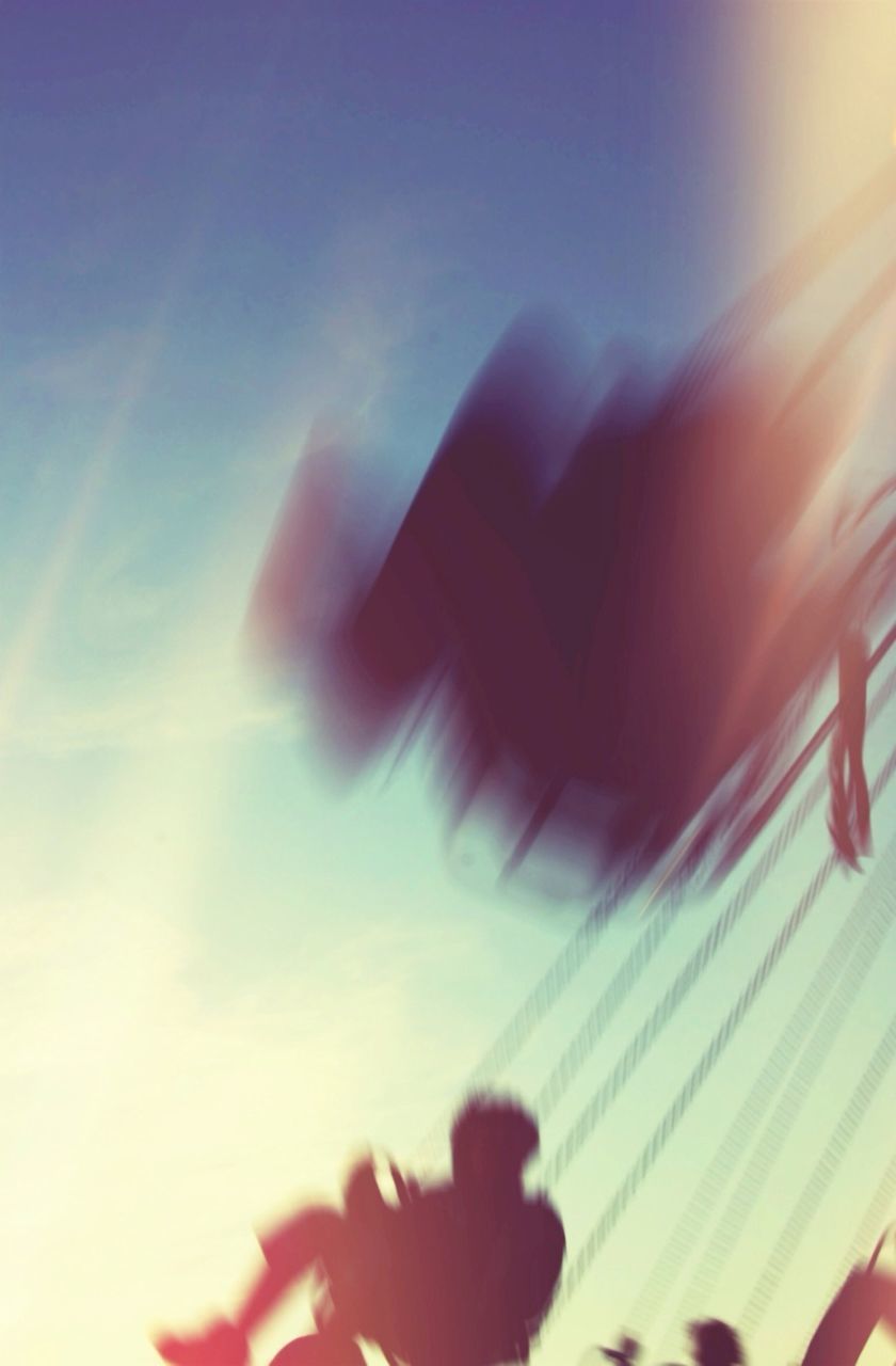 WOMAN STANDING AGAINST SKY