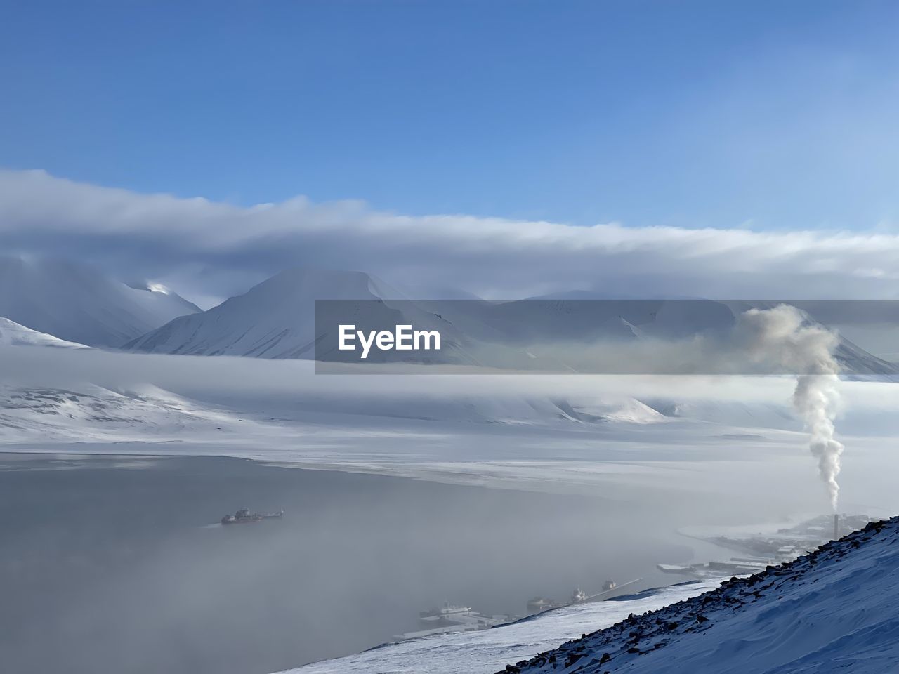scenic view of snow covered mountains against sky