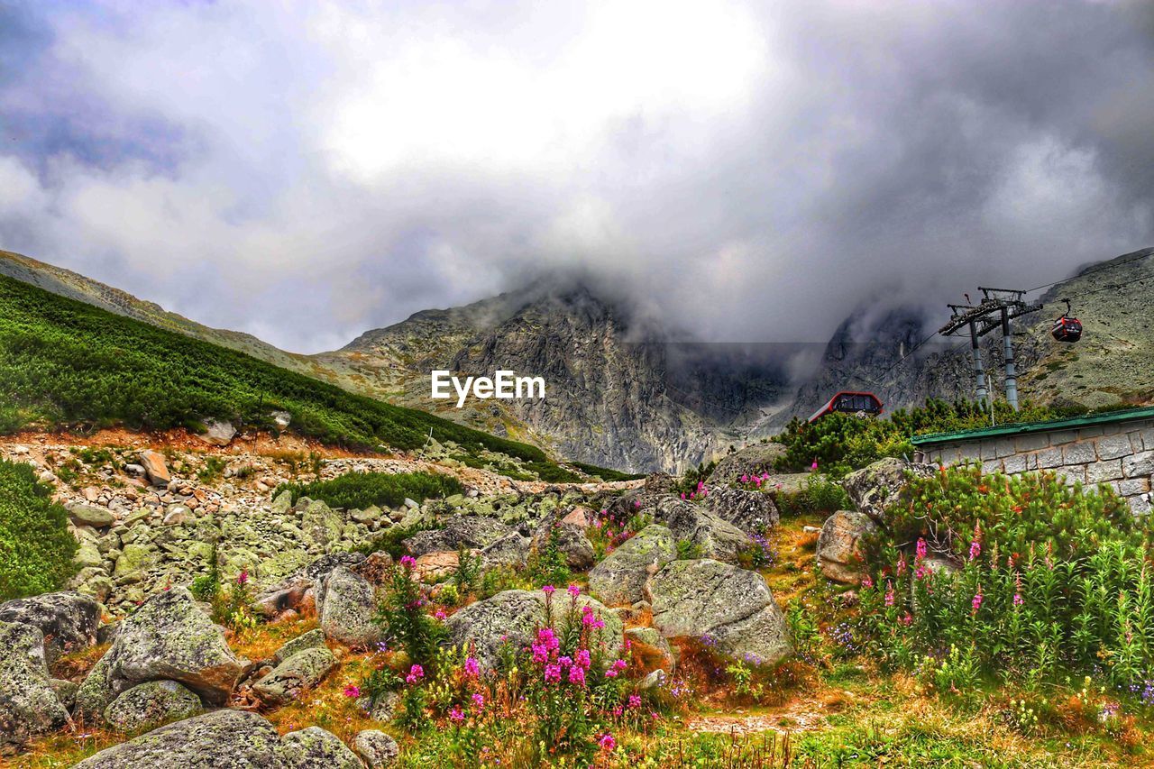 SCENIC VIEW OF MOUNTAINS AGAINST SKY DURING WINTER