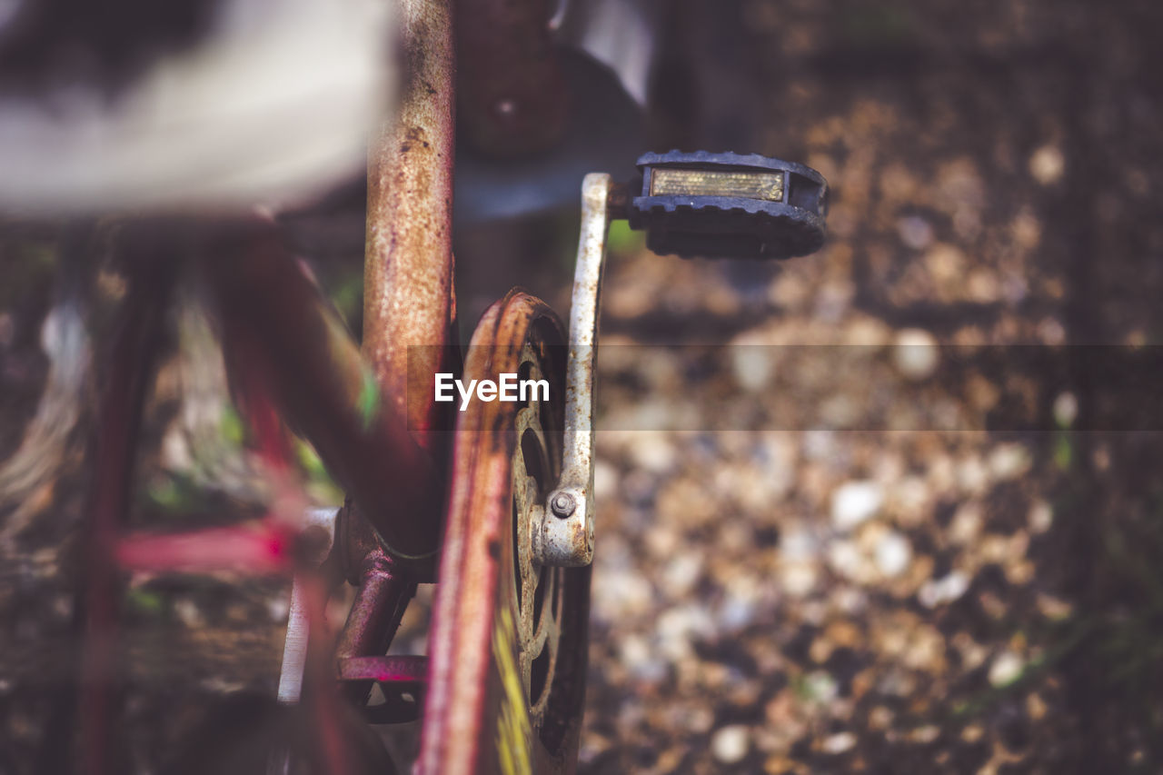 Close-up of bicycle parked on the side of the road