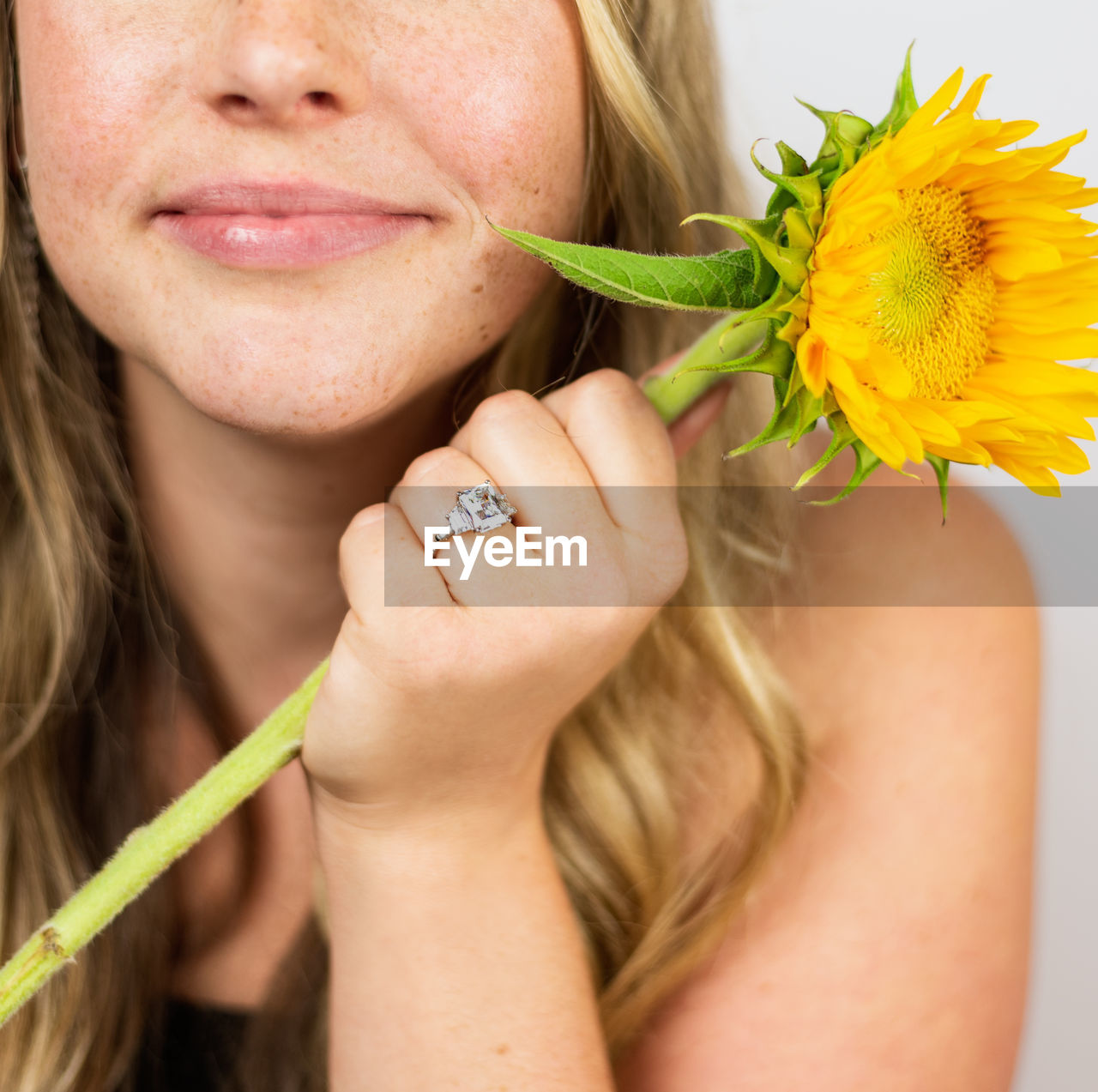 Close-up of woman holding flower