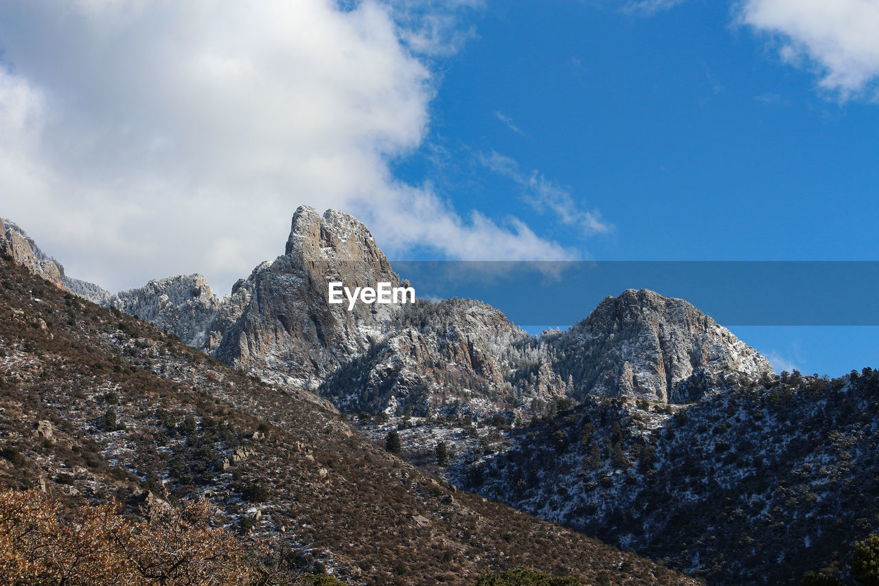 Panoramic view of rocks and mountains against sky