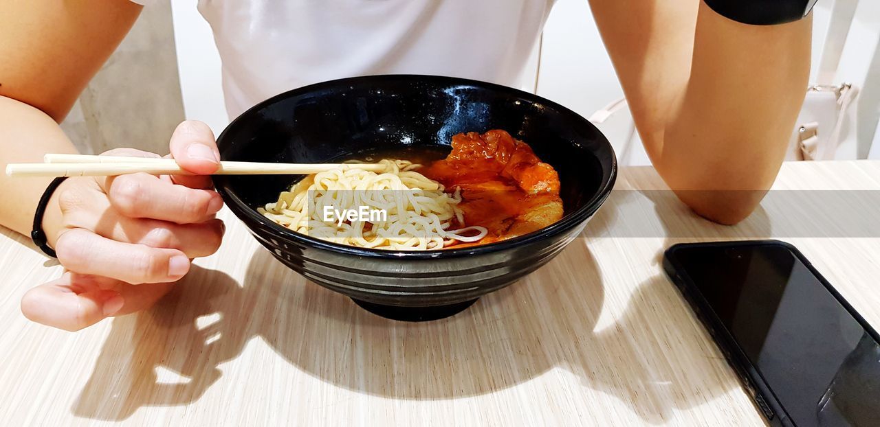 Midsection of woman preparing food