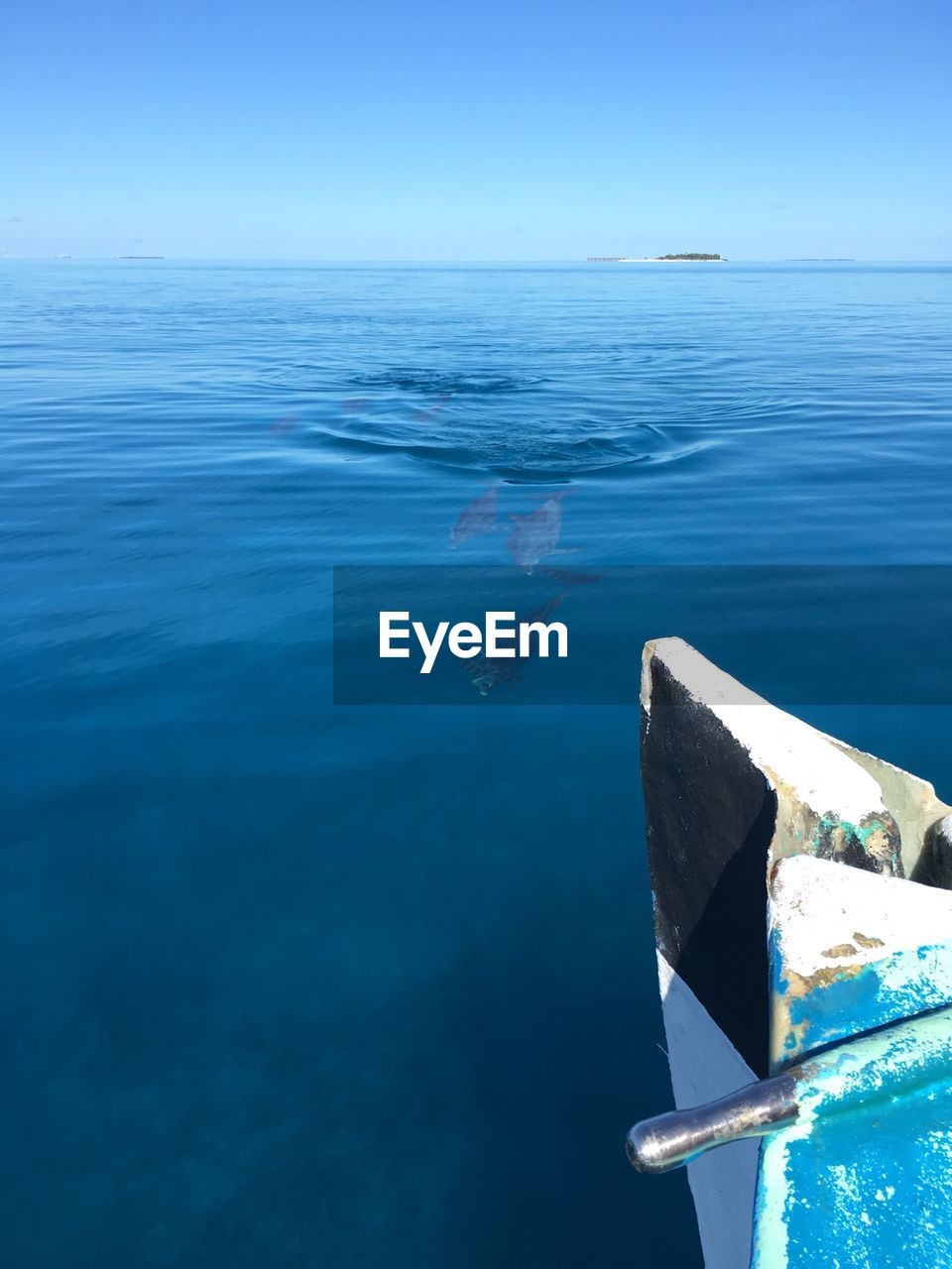 CLOSE-UP OF BLUE SEA AGAINST SKY