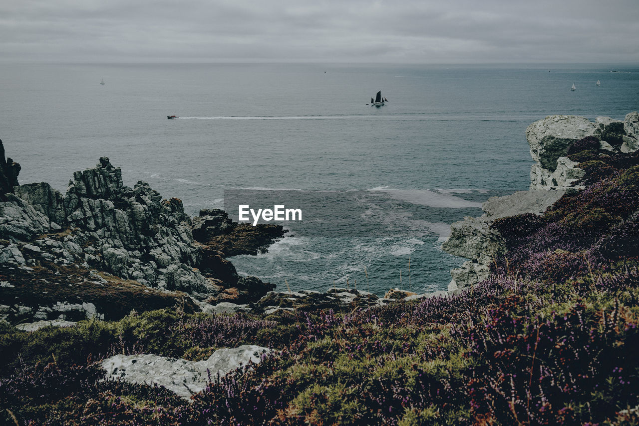 SCENIC VIEW OF SEA AND ROCKS