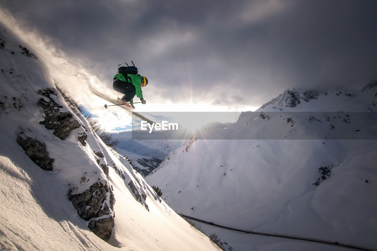 Man skiing on snowcapped mountain