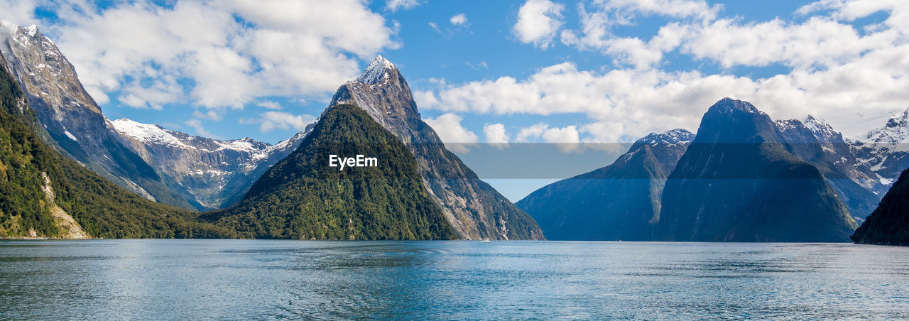 Scenic view of lake with mountains in background