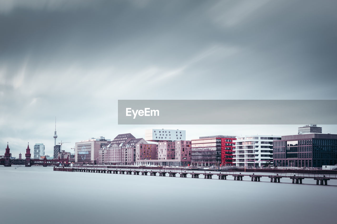 CITYSCAPE AGAINST CLOUDY SKY