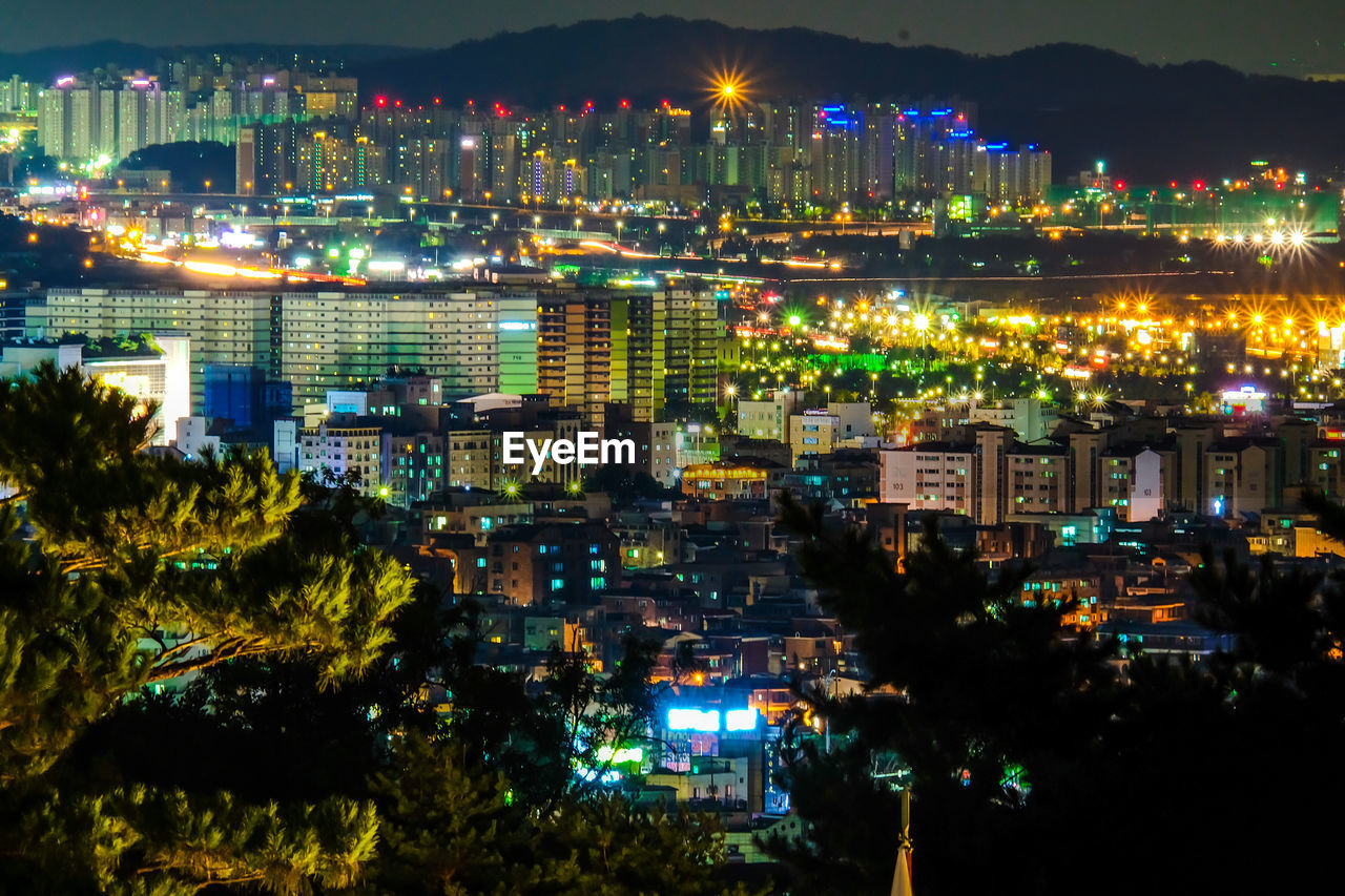 High angle view of illuminated cityscape at night