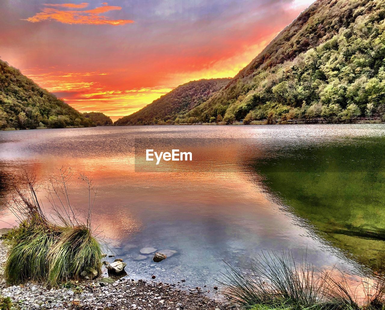 SCENIC VIEW OF LAKE DURING SUNSET