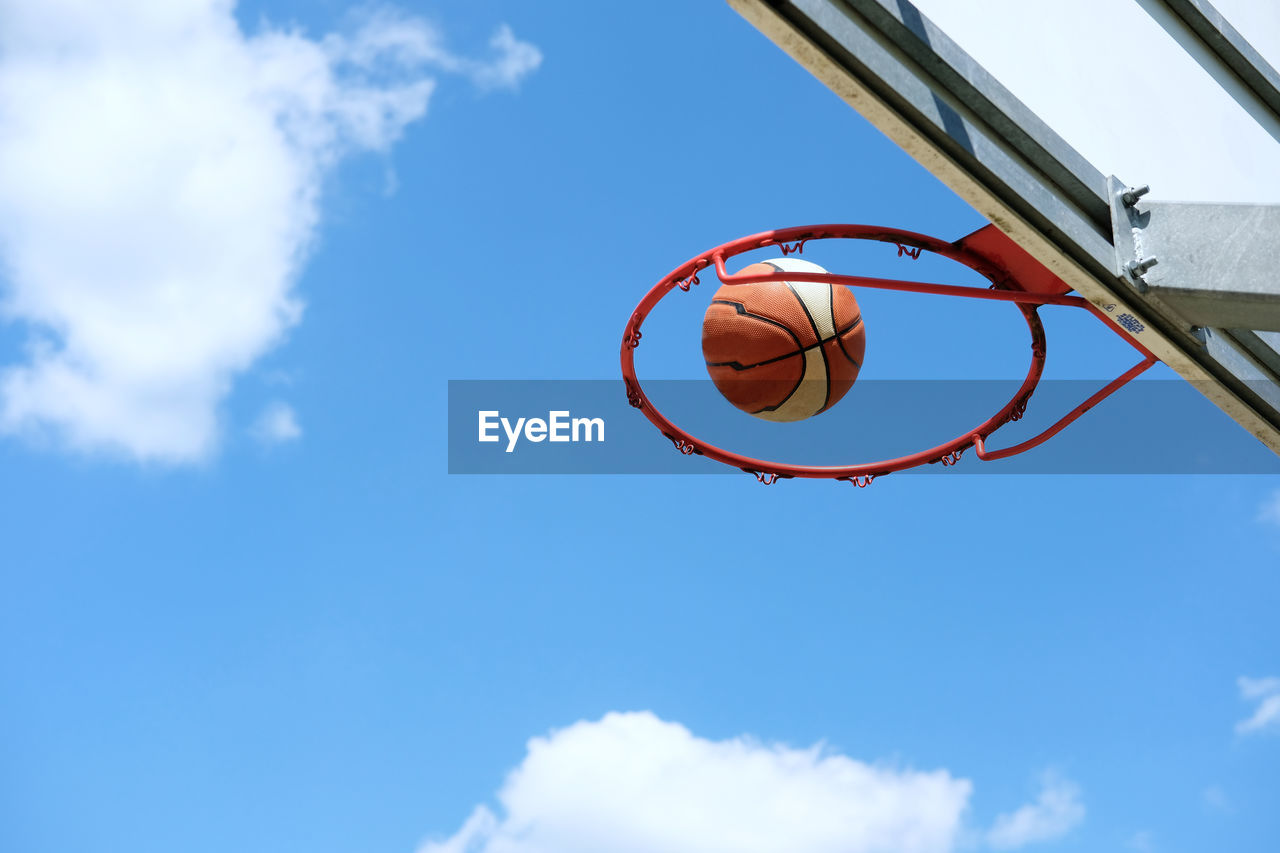 basketball, basketball hoop, sky, sports, cloud, blue, ball, low angle view, basketball - ball, nature, scoring, net - sports equipment, motion, competition, activity, day, basketball player, outdoors, athlete, leisure activity