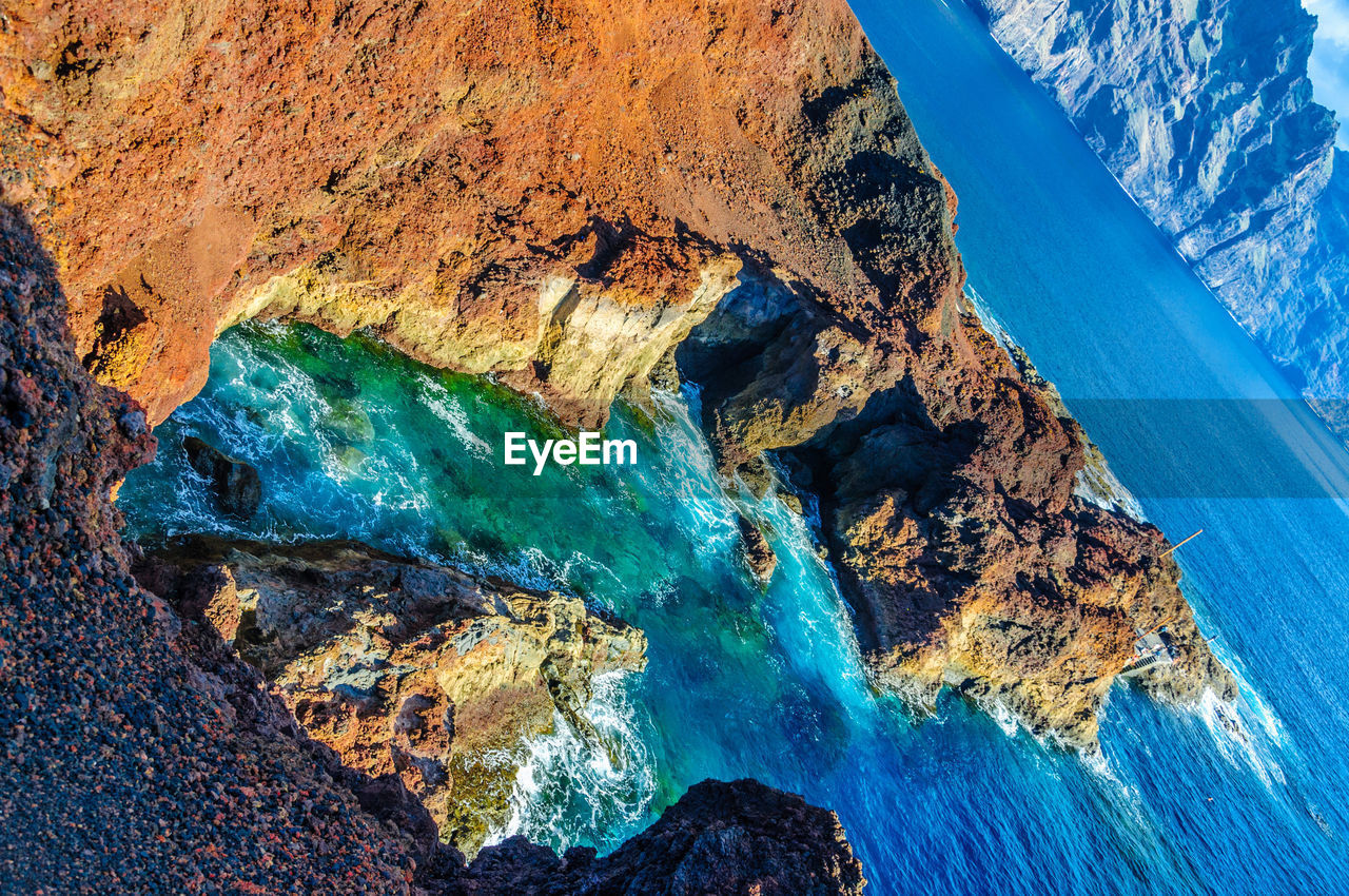 Panoramic shot of rock formation in sea