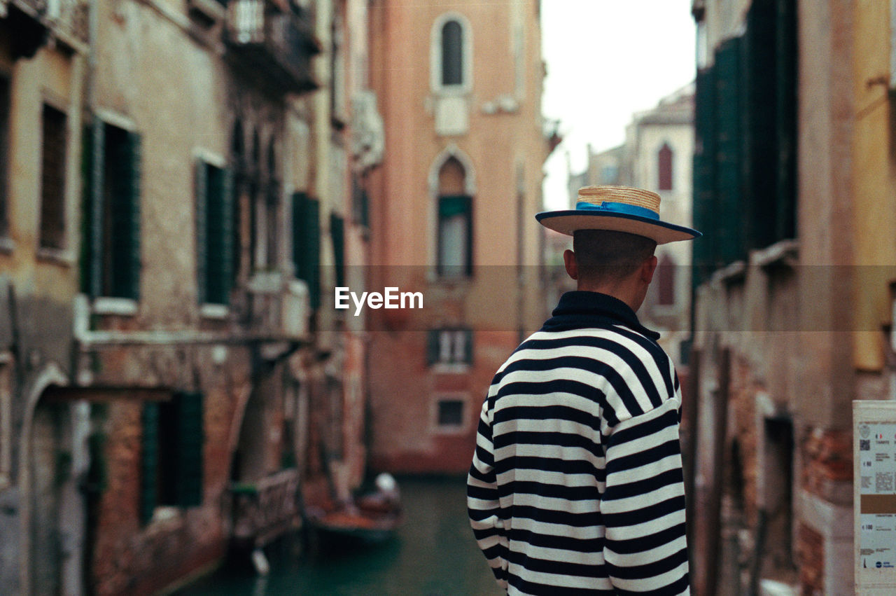 Rear view of gondolier in venice