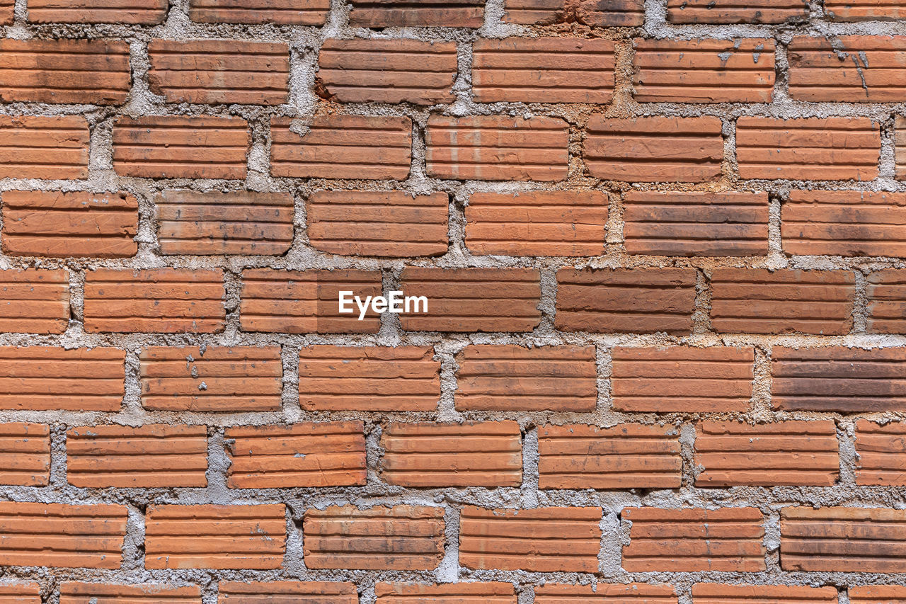 FULL FRAME SHOT OF STONE WALL