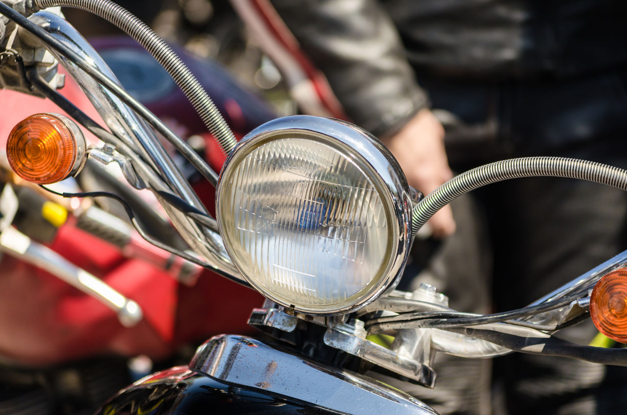 CLOSE-UP OF BICYCLE ON METAL OUTDOORS