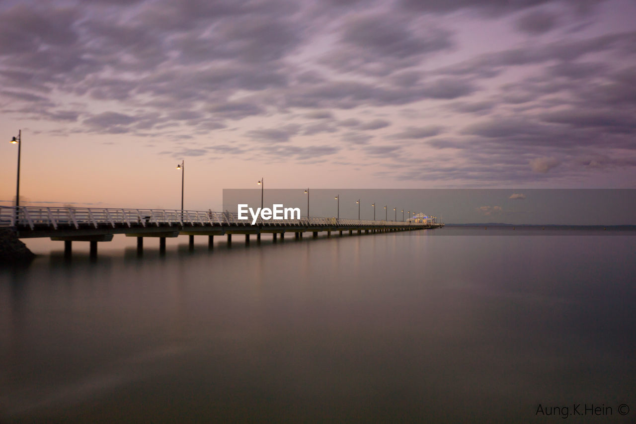 Scenic view of calm sea at sunset