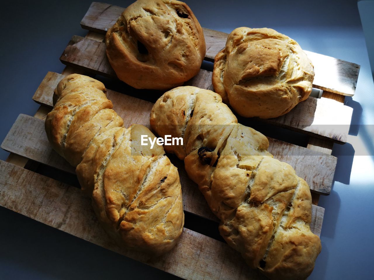 food and drink, food, freshness, baked, bread, indoors, dessert, no people, still life, healthy eating, table, wellbeing, high angle view, store, bakery, loaf of bread, close-up, produce, fast food, french food, group of objects