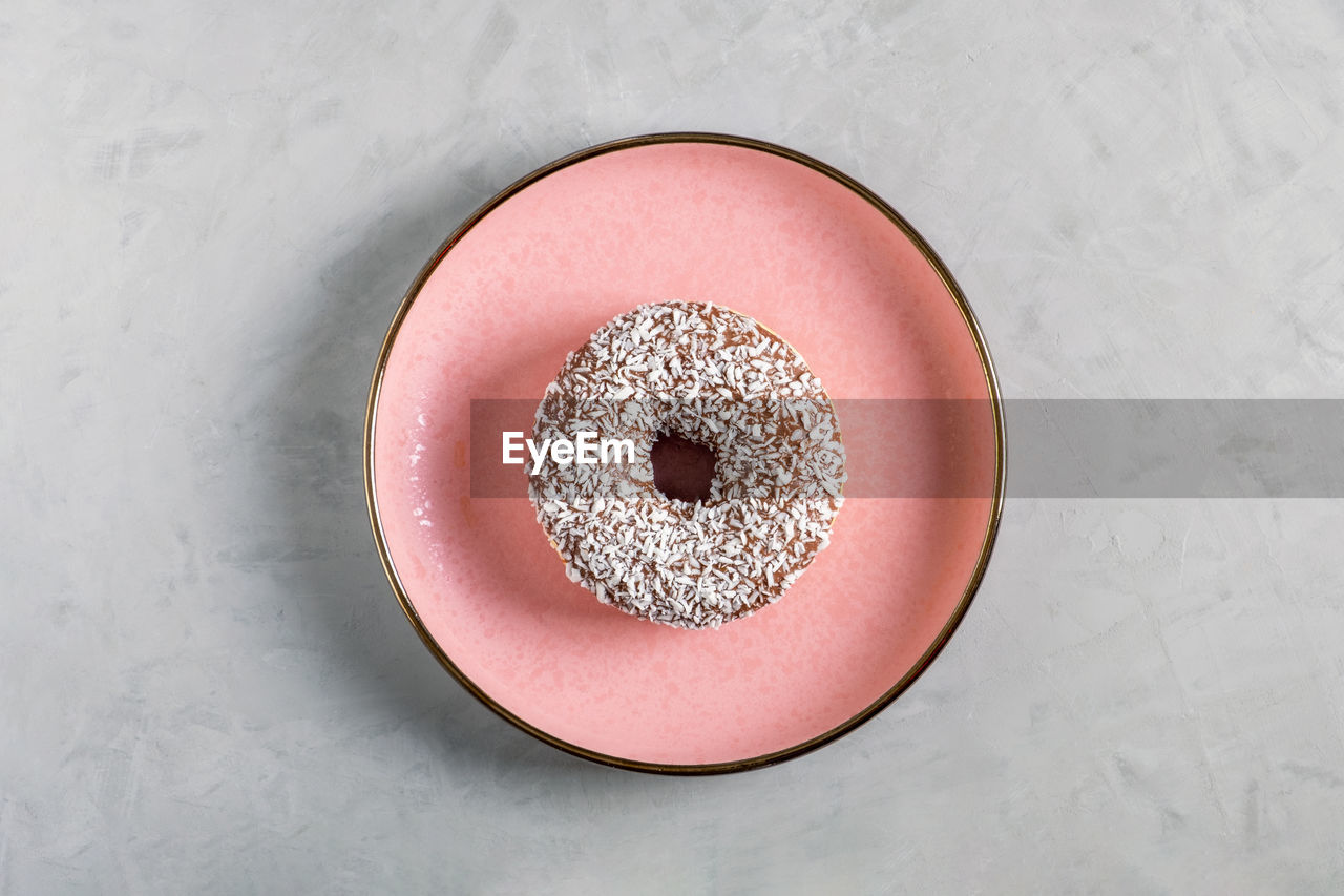 pink, food and drink, human eye, food, directly above, indoors, circle, high angle view, sweet food, freshness, geometric shape, close-up, shape, studio shot, table, still life, red, sweet, lip, fashion accessory