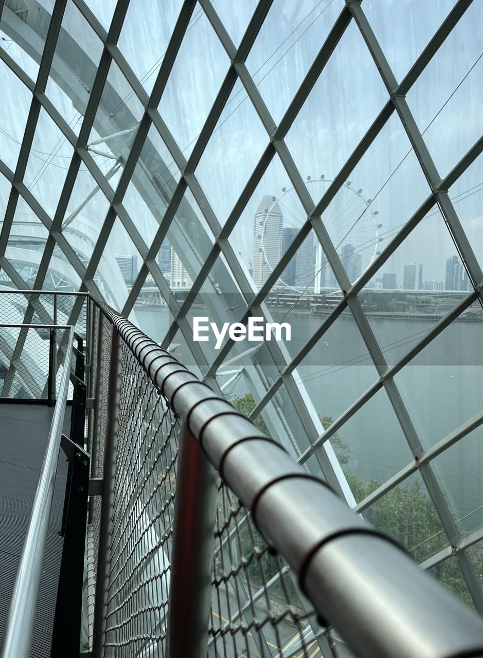 built structure, architecture, pattern, no people, metal, ceiling, low angle view, daylighting, line, day, indoors, glass, iron, sky, facade, city, alloy, steel, nature