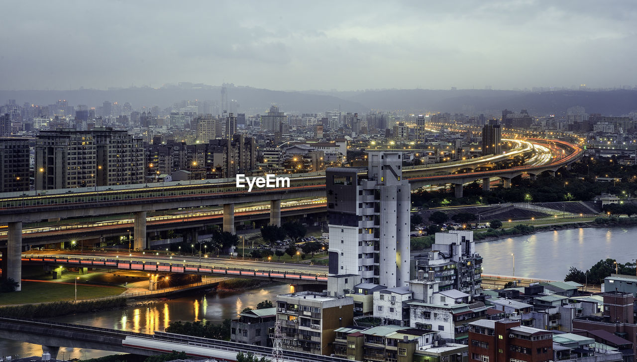 High angle view of bridge over river and buildings in city