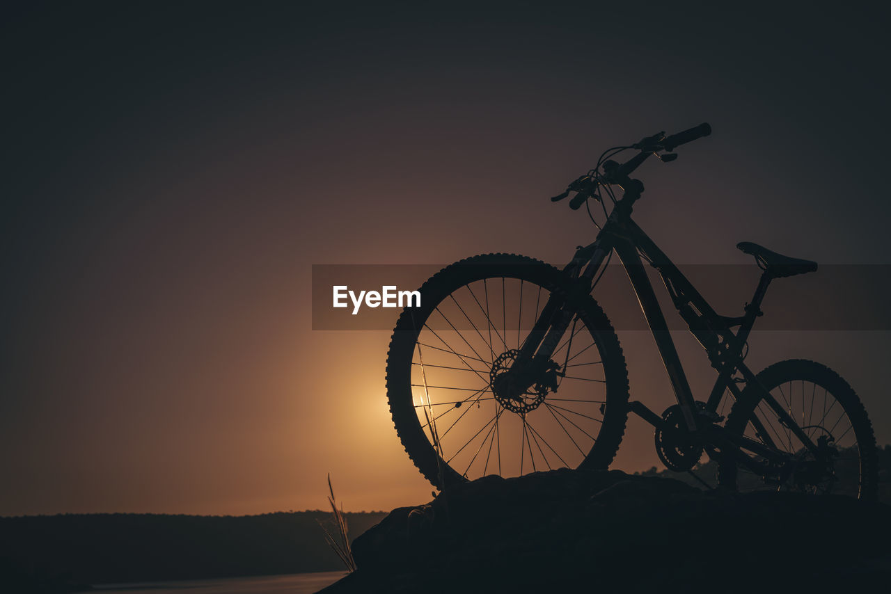 SILHOUETTE OF BICYCLE DURING SUNSET