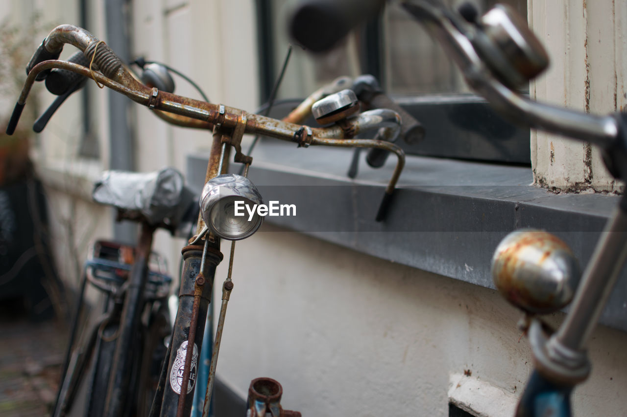 CLOSE-UP OF BICYCLE ON METAL