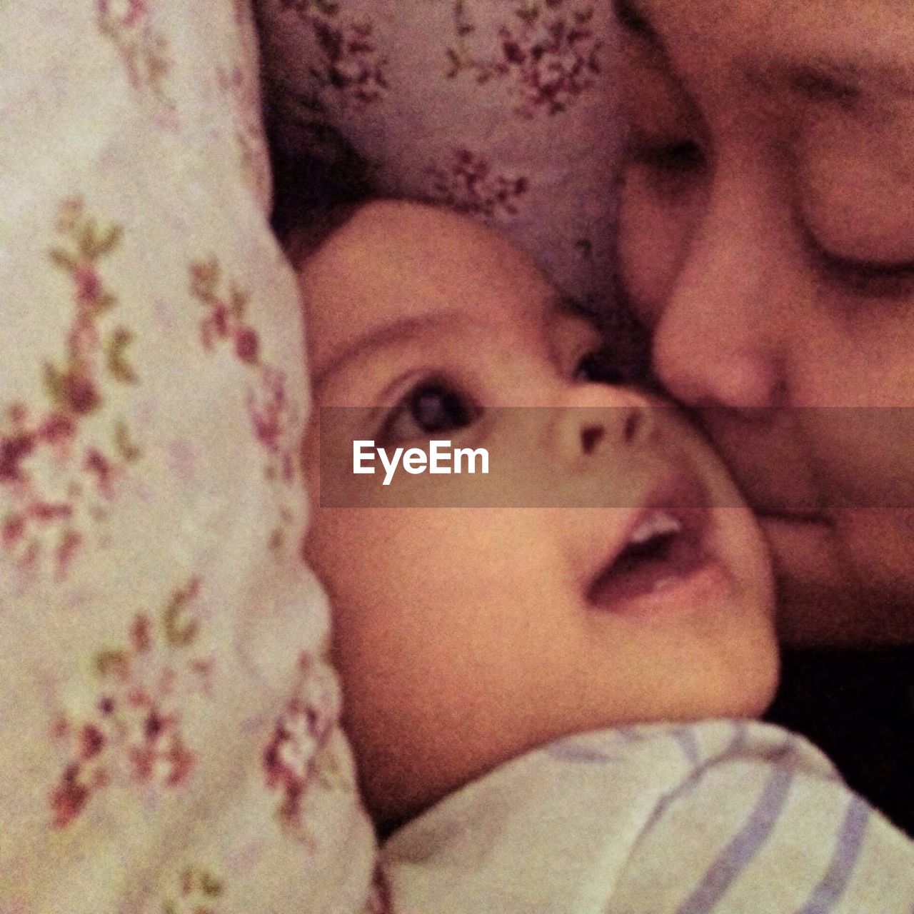 Close-up of mother kissing boy on cheek